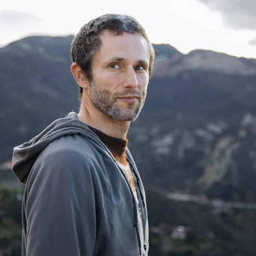 Cover photo of Heresy To The God Of Capitalism w/ Charles Eisenstein